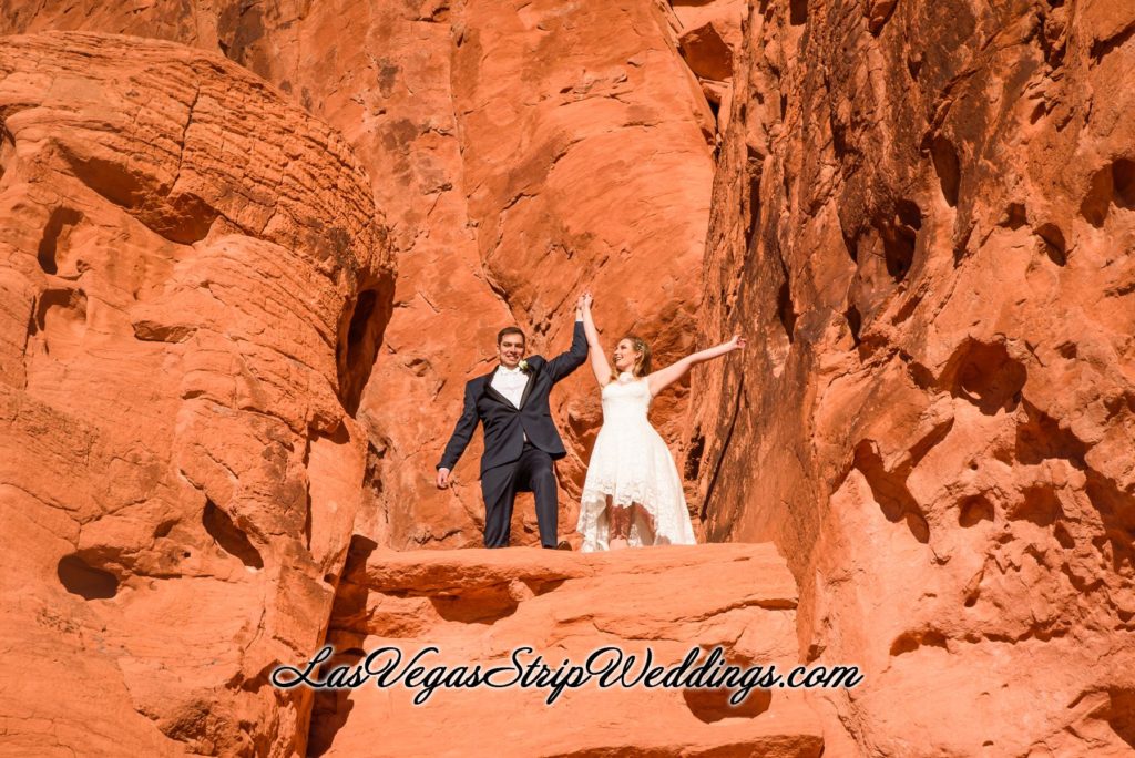 A woman getting ready for wedding photography in Valley of Fire, NV