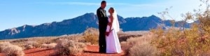 Photo of groom and bride having a Valley of Fire wedding with sweeping vistas as the backdrop.
